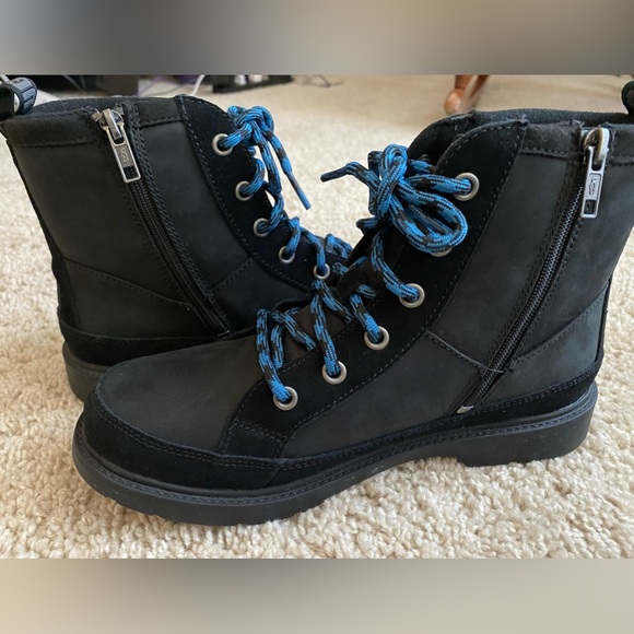 UGG Other - Black Ugg boots with blue laces. NWOT. *rare. Women’s size 7, men’s size 6